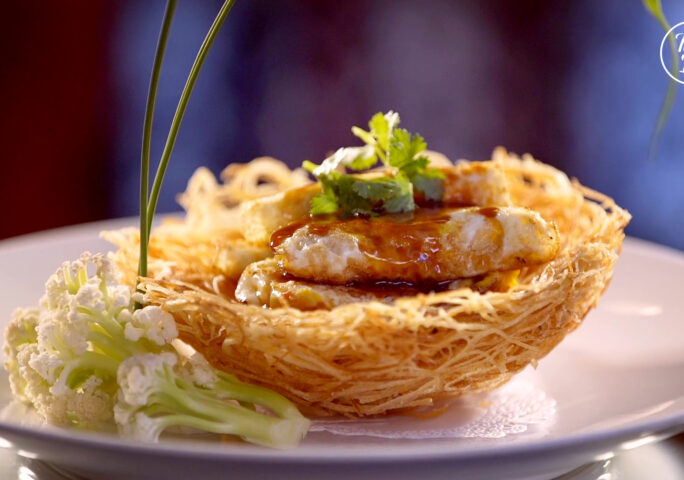 Abalone Over Eggs in Crispy Potato Nest