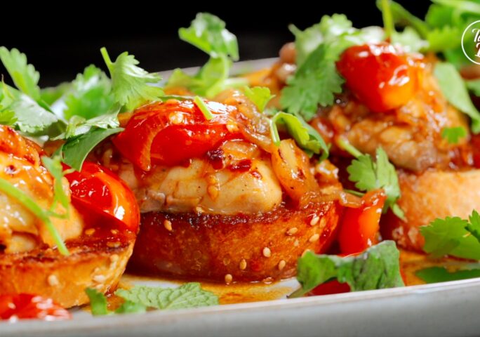 Porgy with Tomato and Wine Sauce Over Garlic Bread
