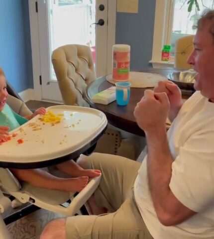 Father Pretends To Use Magic Power And Pulls Son's Highchair Closer To Him While Playing