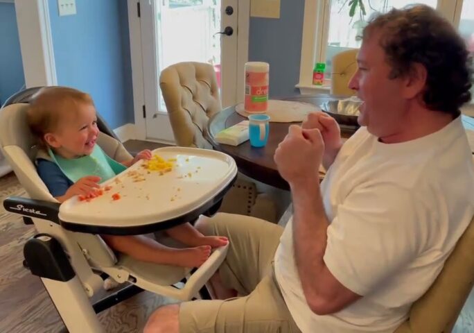 Father Pretends To Use Magic Power And Pulls Son’s Highchair Closer To Him While Playing